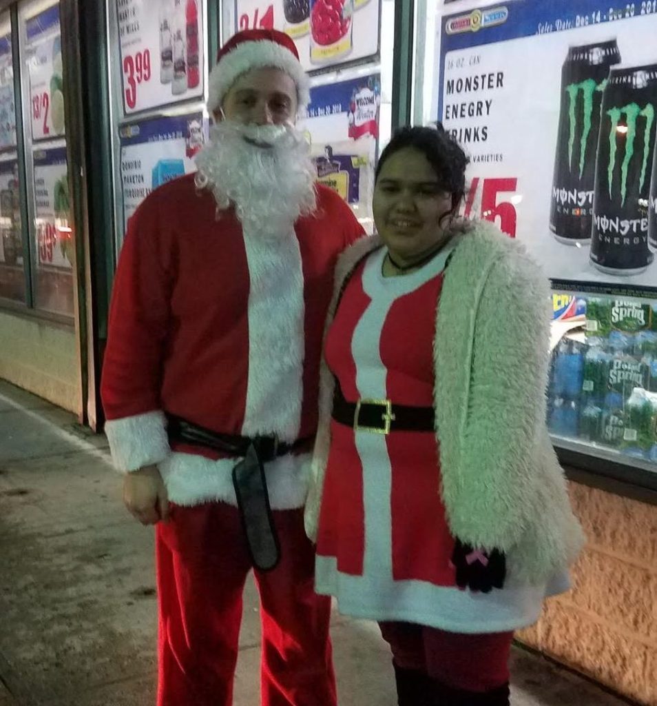2 people dressed as Santa