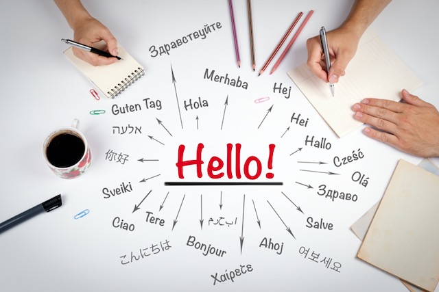 Hello word in different languages of the world. The meeting at the white office table
